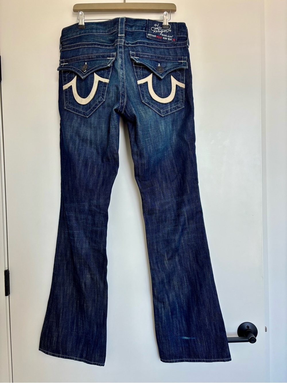 Vintage made in USA True Religion men’s dark blue bootcut jeans, leather accent